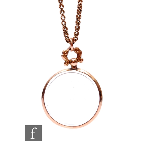 182 - An early 20th Century 9ct circular open locket suspended from a 9ct fancy belcher chain, total weigh... 