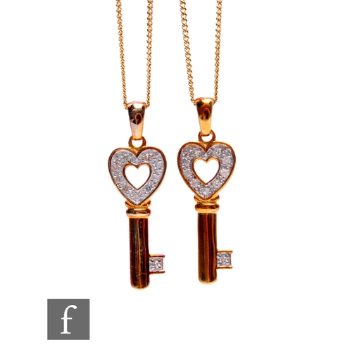 192 - Two 9ct gold Royal Mint Classics key pendants and chains, the heart shaped head inset with brilliant... 