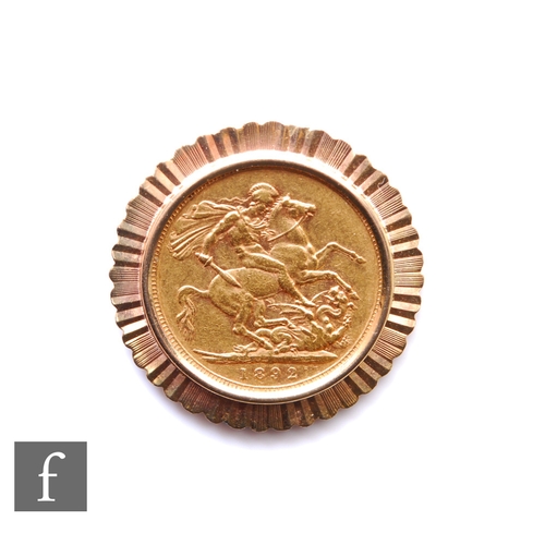 50 - A Victorian full sovereign dated 1892, set to a 9ct mount, weight 9.5g.