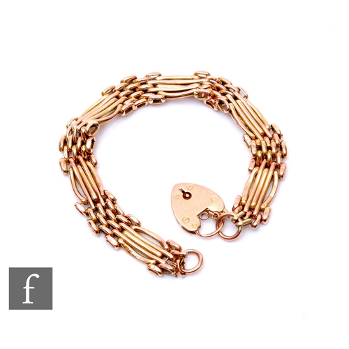 56 - A 9ct rose gold five bar gate bracelet, weight 11.5g, terminating in padlock fastener, damaged.