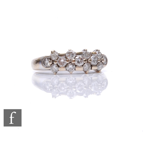 73 - An 18ct white gold three row diamond ring comprising thirteen individually claw set brilliant cut st... 