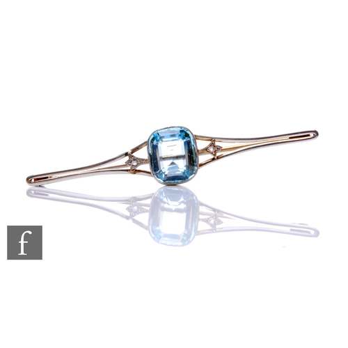 84 - An early 20th Century 9ct aquamarine and diamond three stone bar brooch, central cushion cut aquamar... 