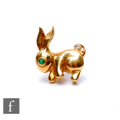 90 - An 18ct pin modelled as a seated rabbit with emerald cabochon set eye and diamond set tail, weight 7... 