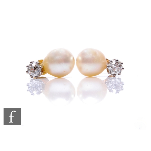 91 - A pair of 18ct hallmarked pearl and diamond stud earrings, each with a claw set old cut diamond, wei... 