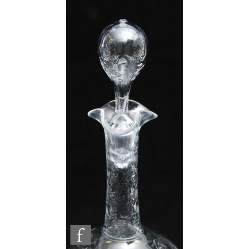 734 - An Art Nouveau glass decanter of footed ovoid form with tall collar neck, polished intaglio cut with... 