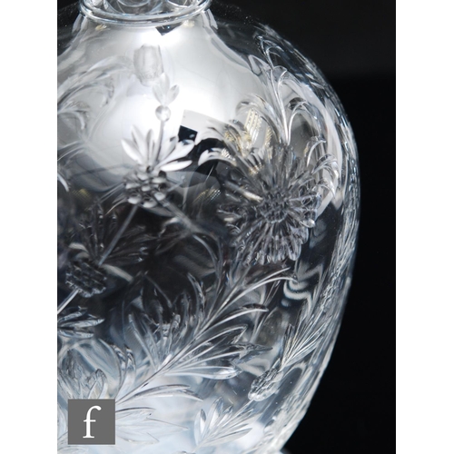 734 - An Art Nouveau glass decanter of footed ovoid form with tall collar neck, polished intaglio cut with... 