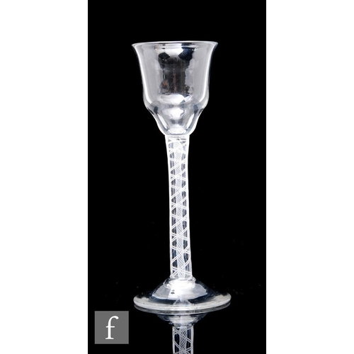 121 - A small 18th Century drinking glass circa 1765, the ogee bowl with everted rim above a double series... 