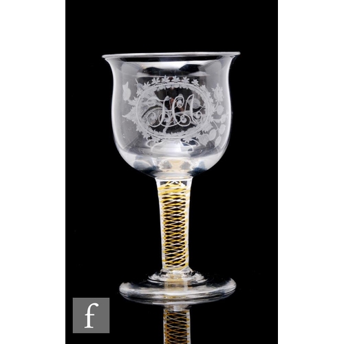 69 - A late Georgian drinking glass circa 1820, the ovoid bowl with everted rim, engraved with a monogram... 