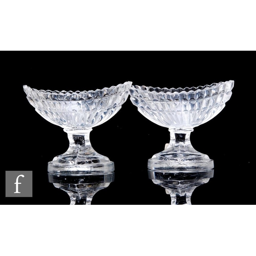 149 - A pair of late Regency table salts circa 1810, the fluted boat shaped bowls above a four sided capst... 