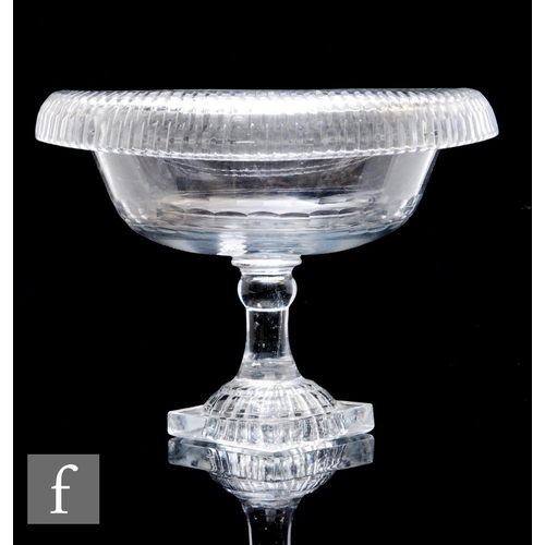 154 - A large late 18th Century Anglo-Irish clear crystal glass pedestal bowl, the oval body with deep rol... 