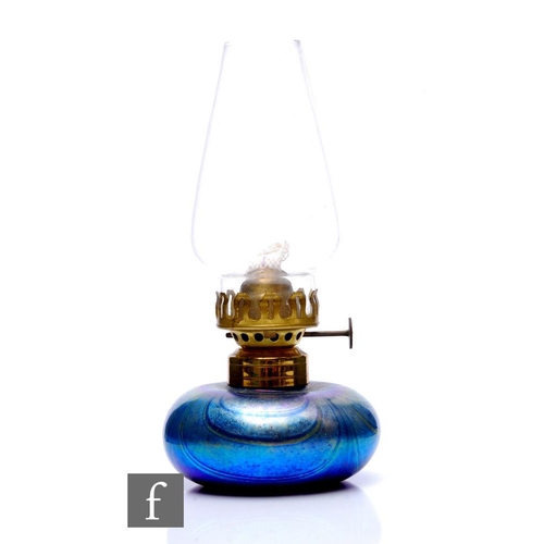 761 - A later 20th Century Siddy Langley studio glass oil lamp of compressed ovoid form with pulled feathe... 