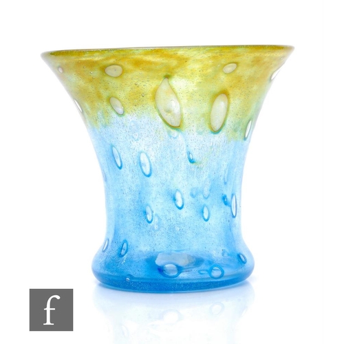 743 - A Monart glass vase of flared cylinder form, in yellow and blue with internal air bubbles, paper lab... 