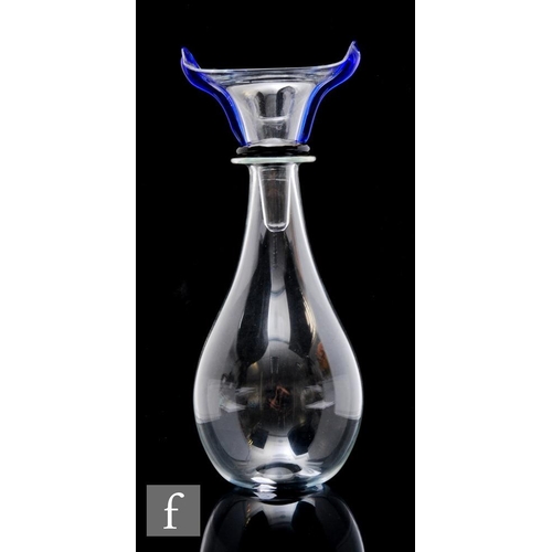 757 - A contemporary studio glass decanter of skittle form with black spot prunt to the base below a styli... 