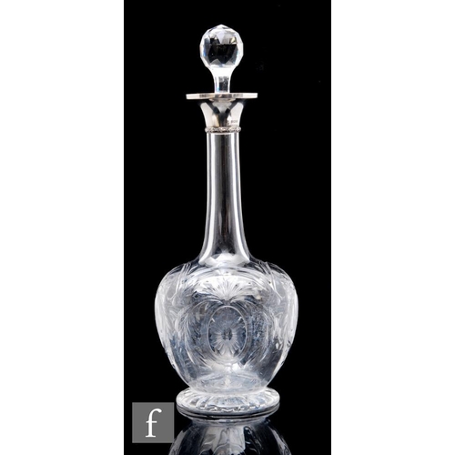 733 - An early 20th Century hallmarked silver and glass decanter of footed globe and shaft form, decorated... 