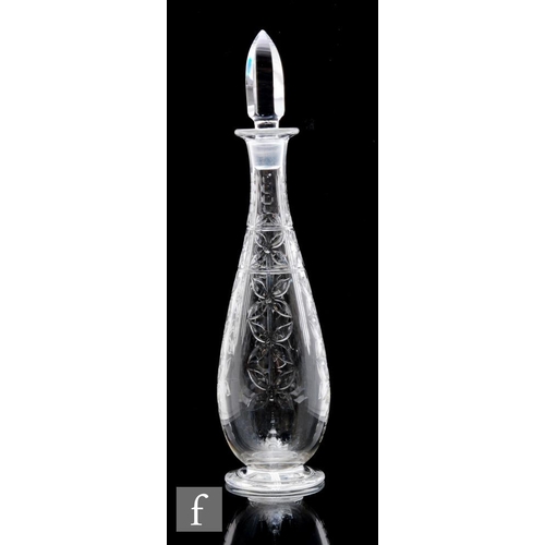 736 - A Webb Corbett glass decanter of footed slender tapering form, engraved with vertical panels of styl... 