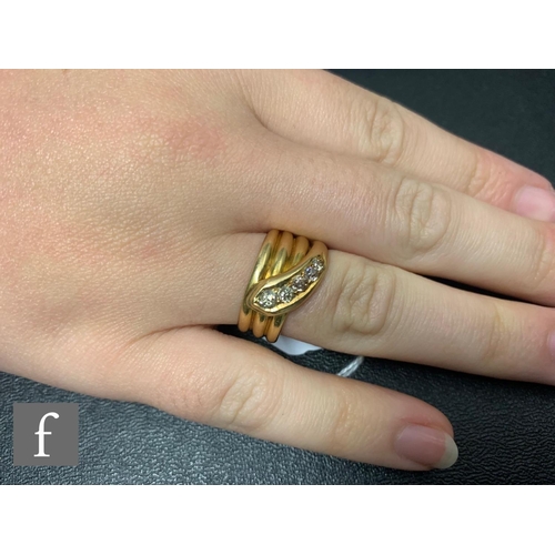 127 - An early 20th Century 18ct hallmarked three coil snake ring with five graduated old cut diamonds to ... 