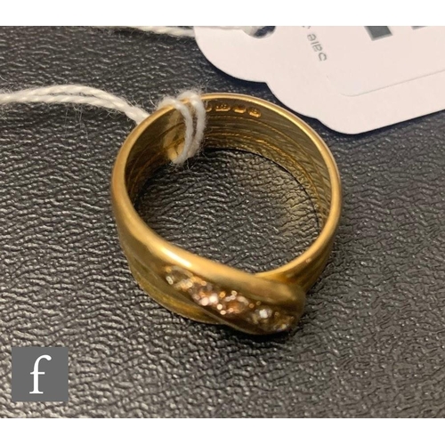 127 - An early 20th Century 18ct hallmarked three coil snake ring with five graduated old cut diamonds to ... 