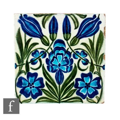 414 - A 19th Century William De Morgan 6 inch plastic clay tile decorated with a stylised Persian floral m... 