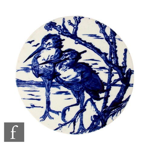 176 - A large unmarked circular ceramic panel transfer printed with an underglaze blue and white design of... 