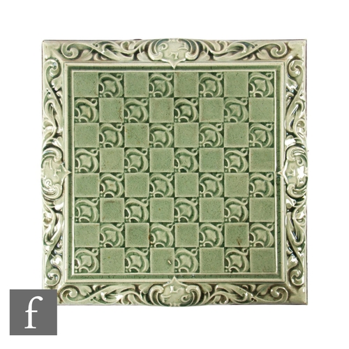 507 - A later 19th Century The Leeds Fireclay Co Ltd 8 inch dust pressed tile, decorated with a central ch... 