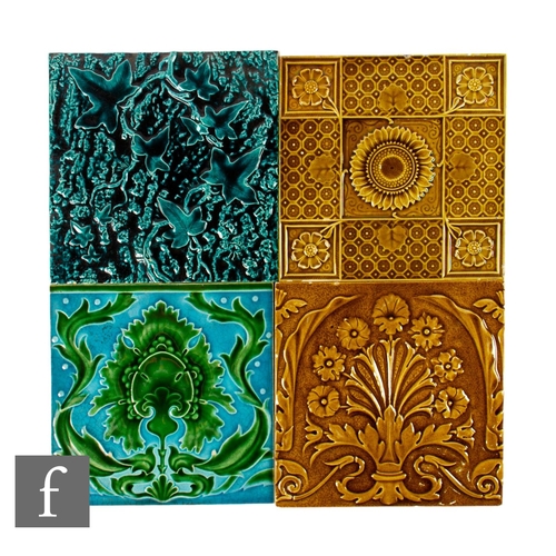 508 - A collection of four later 19th Century to early 20th Century 8 inch dust pressed tiles, all with re... 