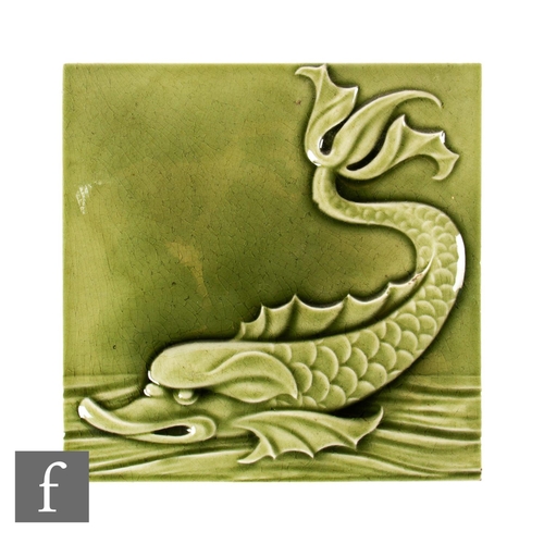 131 - A 19th Century Maw & Co Floreat Salopia 8 inch dust pressed tile, celadon glazed, modelled in re... 