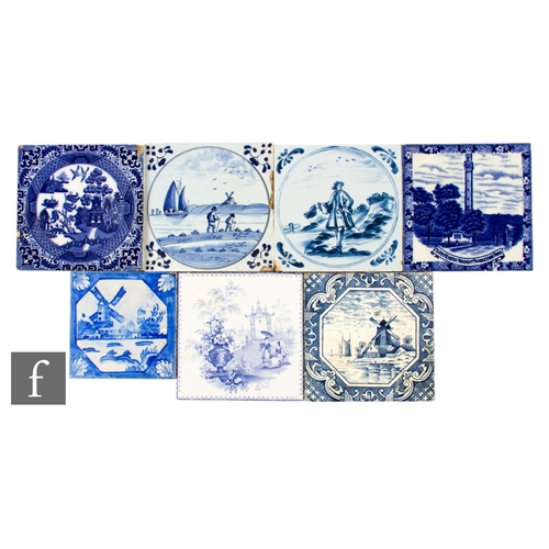 550 - A collection seven of blue and white 6 inch dust pressed tiles, blue transfer printed and painted de... 