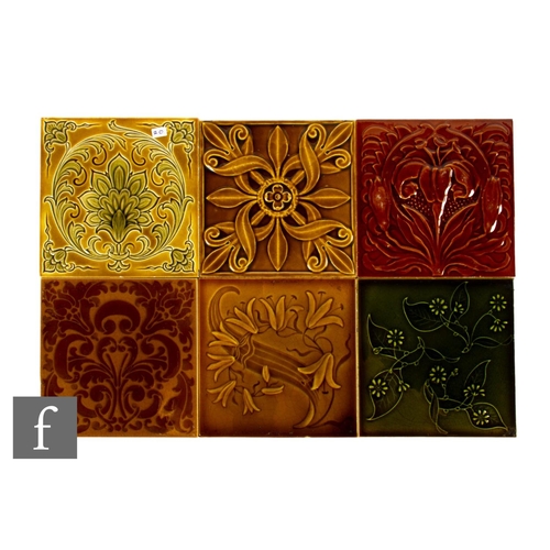 335 - A collection of early 20th Century Pilkington's 6 inch dust pressed tiles, each relief moulded and h... 