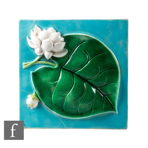 584 - A 19th Century Majolica 8 inch plastic clay tile, moulded in high relief with a water lily picked ou... 