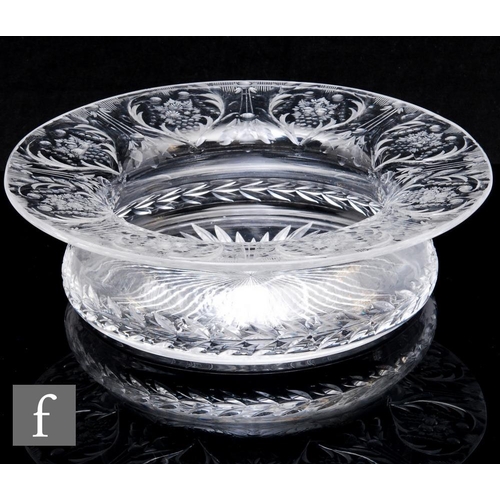 715 - A large early 20th Century Stourbridge clear crystal glass bowl, the compressed shallow body rising ... 