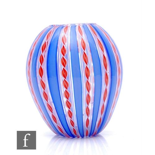 546 - A 20th Century Italian Murano glass vase of ovoid form, internally decorated with vertical alternati... 