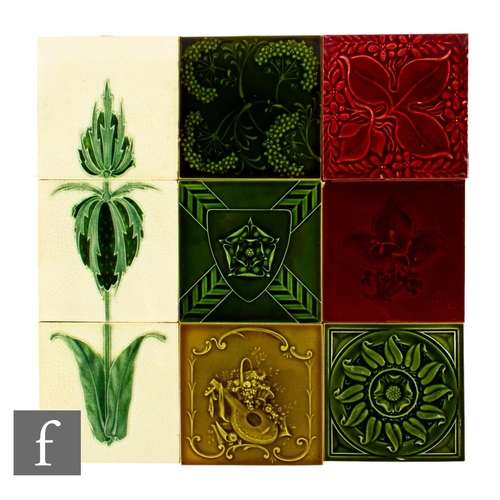 341 - An early 20th Century Pilkington's three 6 inch tile panel, decorated to form a stylised green flora... 