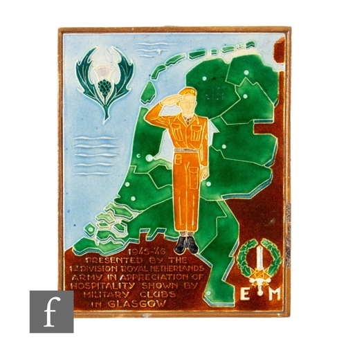 828 - A Dutch Westraven tile tube line decorated with a solider saluting before an outline of the Netherla... 