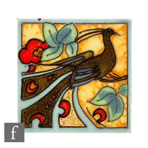 843 - A 1930s Henry Richards 4 inch dust pressed tile, tube line decorated with a stylised peacock to a fl... 