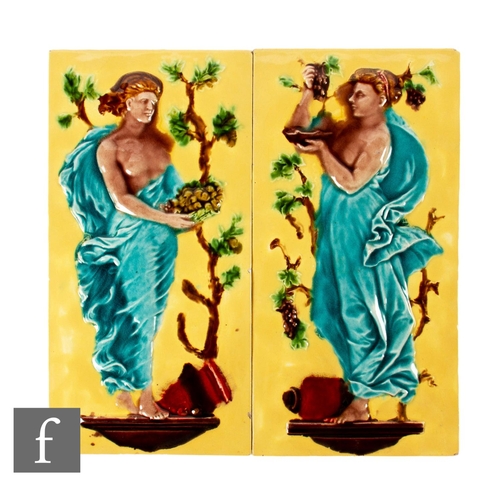 612 - A pair of 19th Century 6 inch x 12 inch plastic clay tiles, modelled in high relief with classically... 