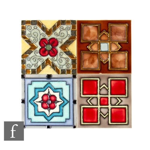 153 - A group of four 1930s 4 inch dust pressed tiles to include examples by Marsden and Maw & Co, tub... 