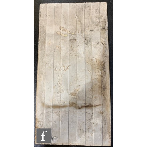 360 - An early 20th Century Pilkington's 6 inch x 12 inch dust pressed tile, relief moulded with a stylise... 