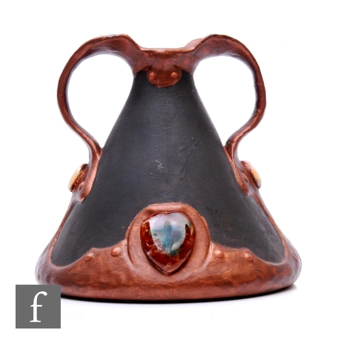 107 - An early 20th Century Bretby twin handled vase decorated in a matt and gloss bronze glaze with faux ... 