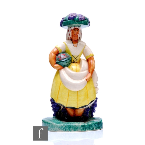 112 - A 1920s French Art Deco figure modelled as a woman gathering grapes, picked out in enamel colours wi... 