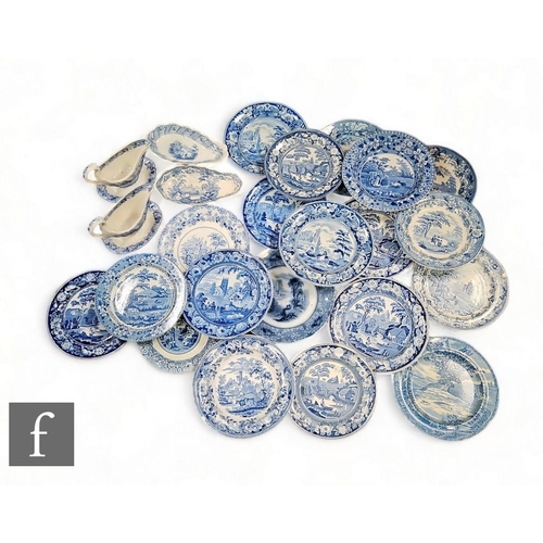 126 - A collection of blue and white transfer printed wares, to include two sauce jugs on stands, plates a... 