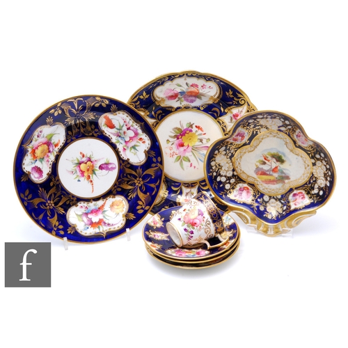 233 - A 19th Century shell shaped dish decorated to the centre with two stylised garden birds amidst a mou... 