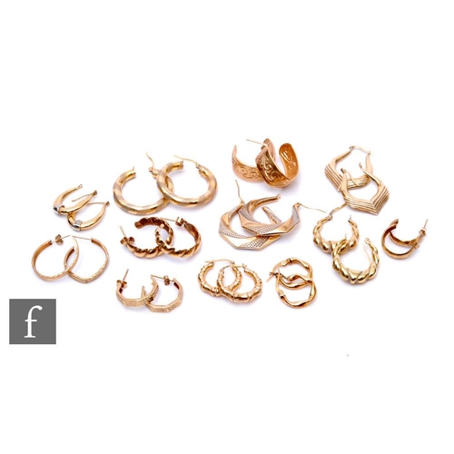 15 - Twelve pairs of 9ct modern hoop earrings to include full and half hoop examples, total weight 16.5g.... 