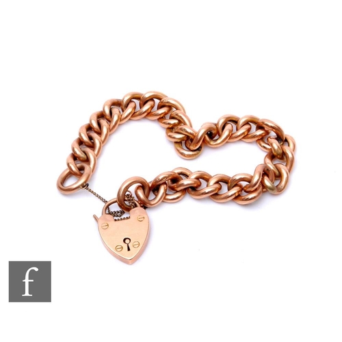 16 - A 9ct rose gold hollow curb link bracelet, weight 24g, terminating in padlock fastener.PLEASE VIEW C... 