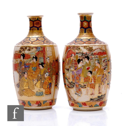 27 - A pair of Japanese satsuma vases, each of bottle form, the body of each with opposing mirror images,... 