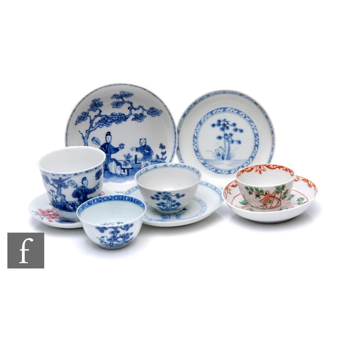 33 - Two 18th Century Nanking Cargo shipwreck porcelain tea bowls and saucers, each with stylised floral ... 