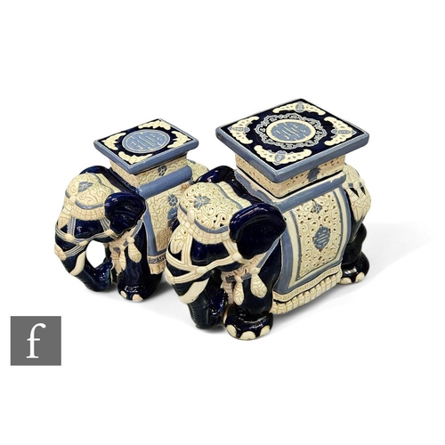 48 - Two contemporary Chinese elephant garden seats, each decorated in ivory and blue glazes, heights 36c... 