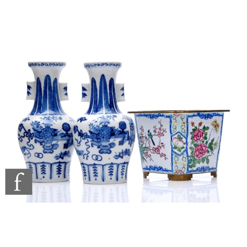 58 - A pair of Chinese Kangxi style blue and white 'Arrow' vases, each of baluster form, decorated with p... 