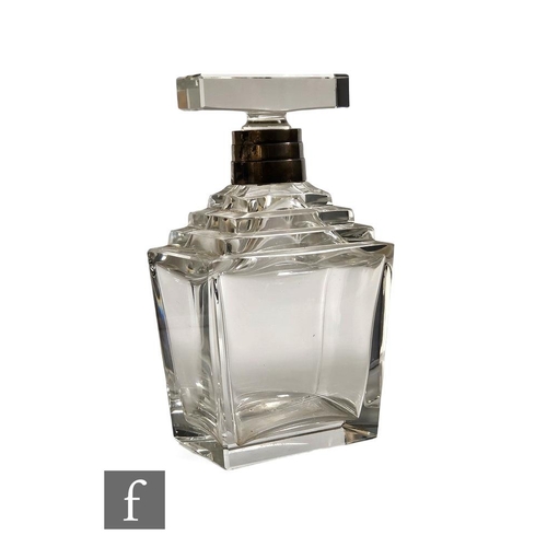 8 - A 1930s Art Deco clear crystal decanter, of stepped rectangular form with a stepped hallmarked silve... 