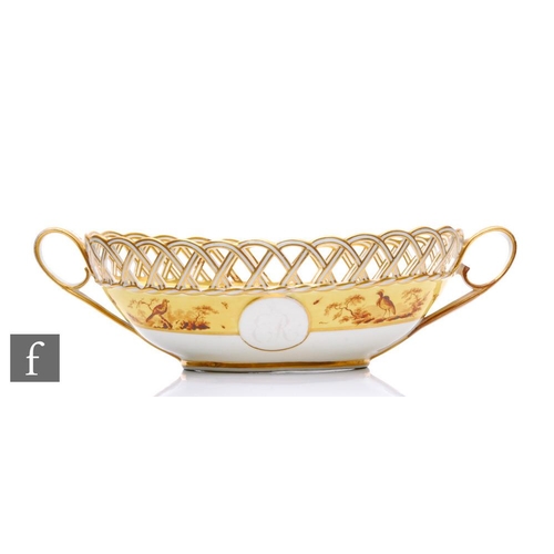 174 - A large 19th Century twin handled bowl/centrepiece of oval form with reticulated basket-weave rim, s... 