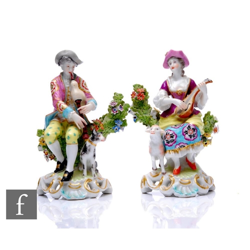 227 - A pair of late 19th to early 20th Century continental hard paste porcelain companion figures of musi... 